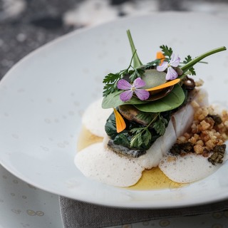 Northsea haddock 48 degrees 'meuniere'   young spinach   barber leaf   pickle and roasted bones   beurre noisette  pieter d'hoop